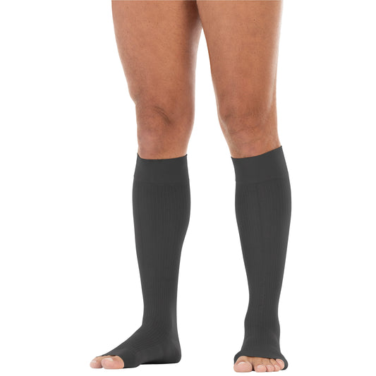 anthracite knee-high socks worn by a person on a white background
