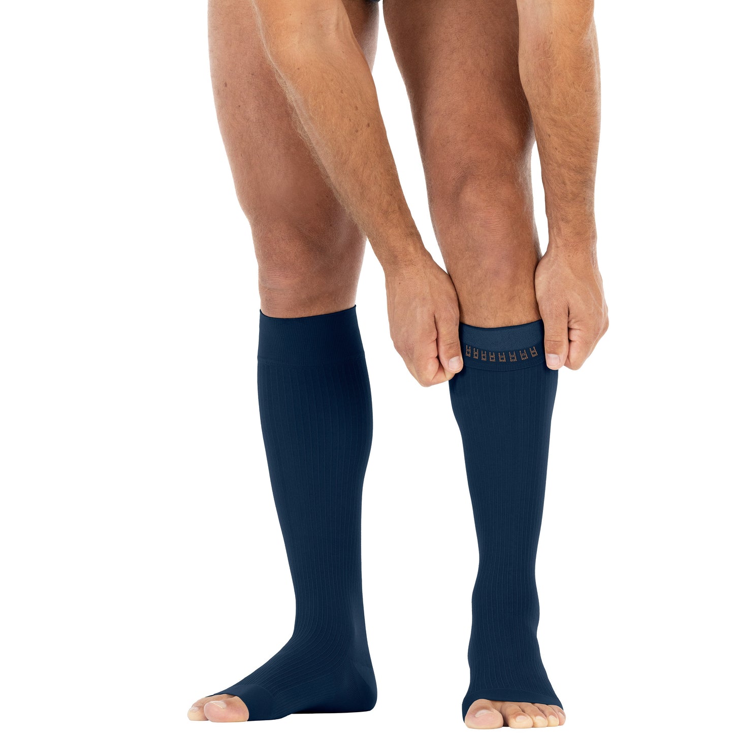 Navy compression socks being worn on a white background