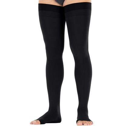 Black thigh-high socks worn by a person on a white background